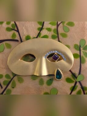Gold Mask Brooch with Purple and Teal Gem Accents